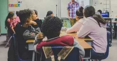 A teacher talking about personal finance to his students.
