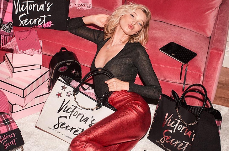 A blonde sexuality with Victoria's Secret shopping bags.