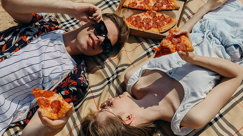 couple celebrating national pizza day