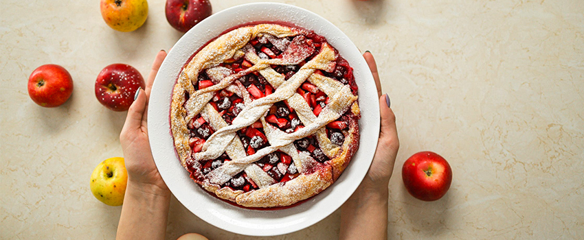 holding an apple pie on national pi day