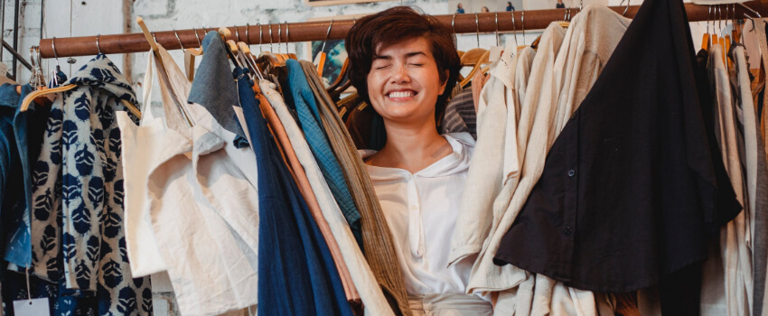 happy woman looking for some clothing