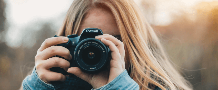 woman taking photos with canon camera from a store with free shipping