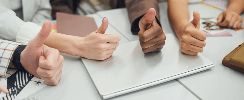 college students with thumbs up