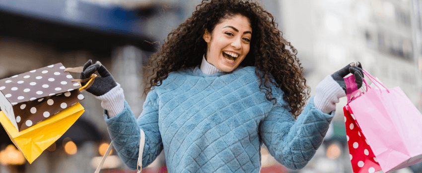happy woman holding shopping bags